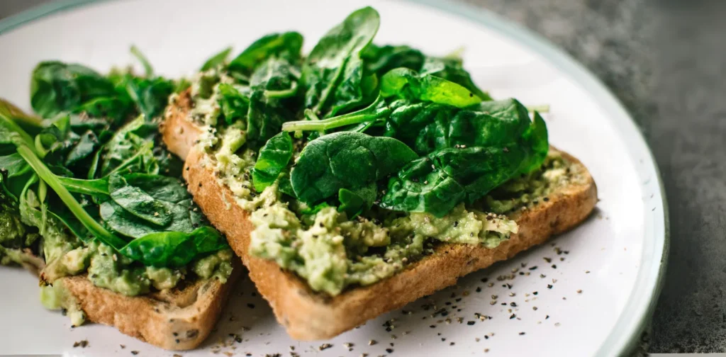 green vegetable on top of bread