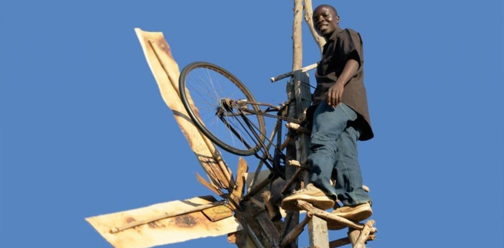 William Kamkwamba and his windmill made of recycled bike wheels