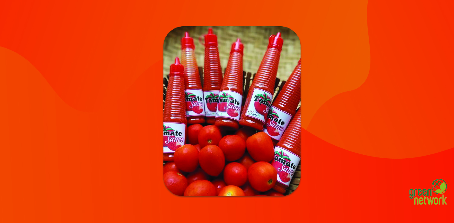 a basket of fresh tomatoes and bottles of tomato ketchup