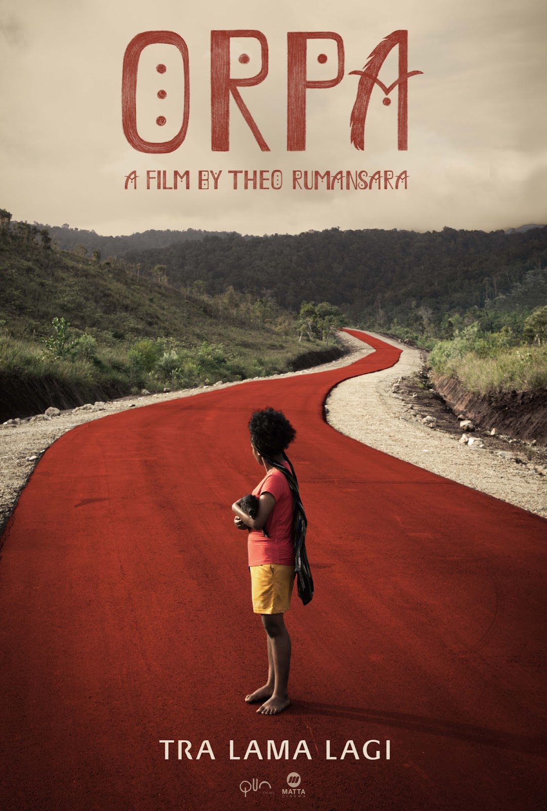 a girl standing barefoot on a red path looking ahead, away from the camera