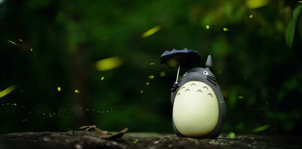 a totoro figurine in the forest