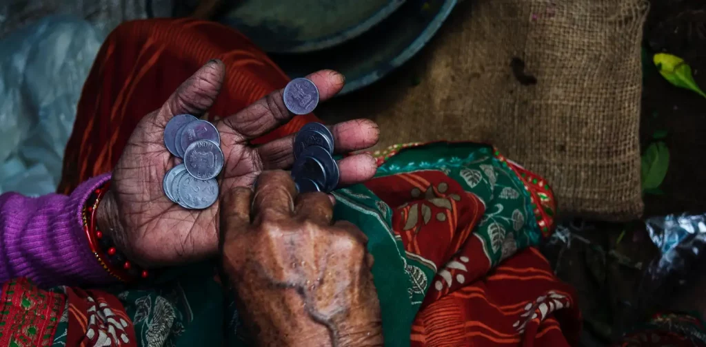 overhead view of hands holding coins