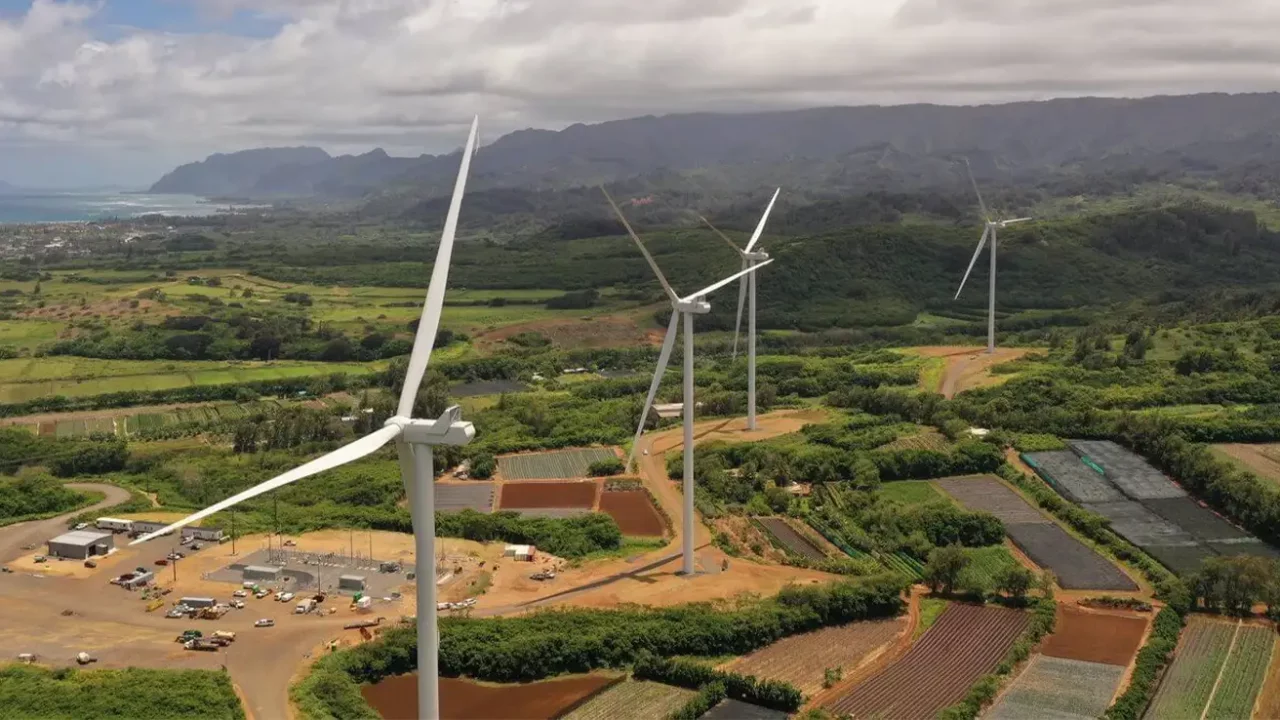 Green hawaiian landscape with four big wind turbines
