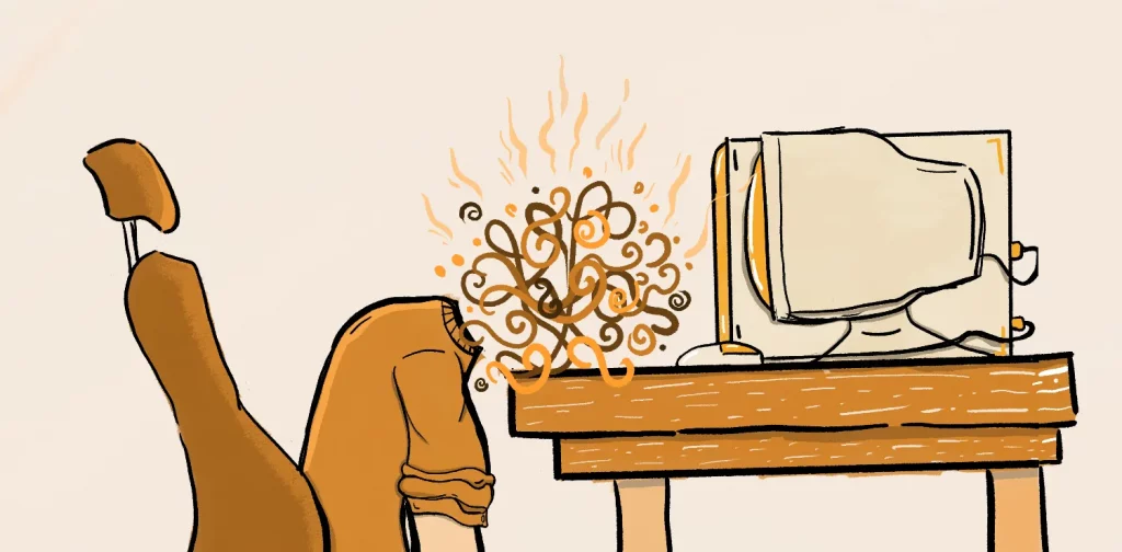 a man in front of computer with burnout mental health