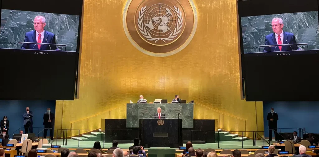 The President of the 77th UN General Assembly Csaba Kőrösi stands behind the podium at the UN’s headquarter