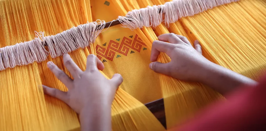 traditional weaving of yellow fabric from toraja, Indonesia
