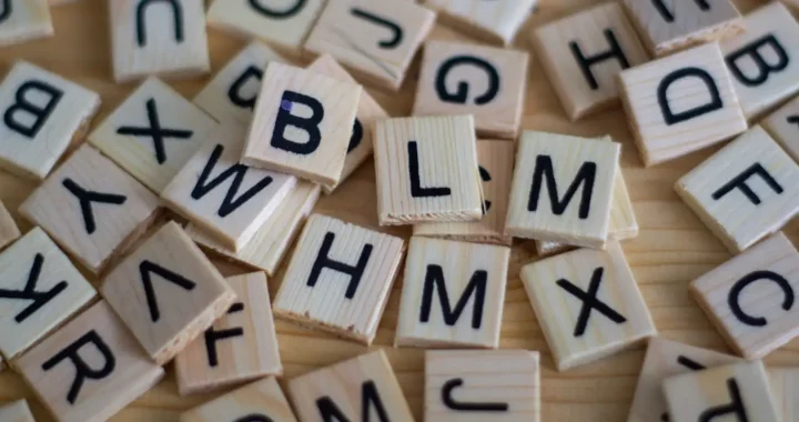 scattered alphabet letters in little squares similar to scrabble