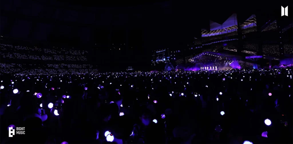 a crowd at a stadium concert