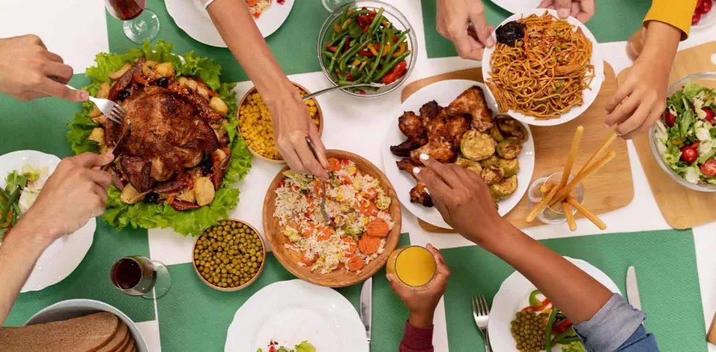 overhead view of a dinner table with a variety of dishes