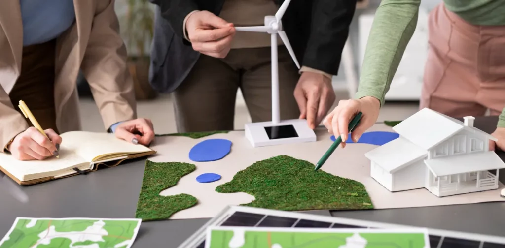 three people planning renewable energy generation