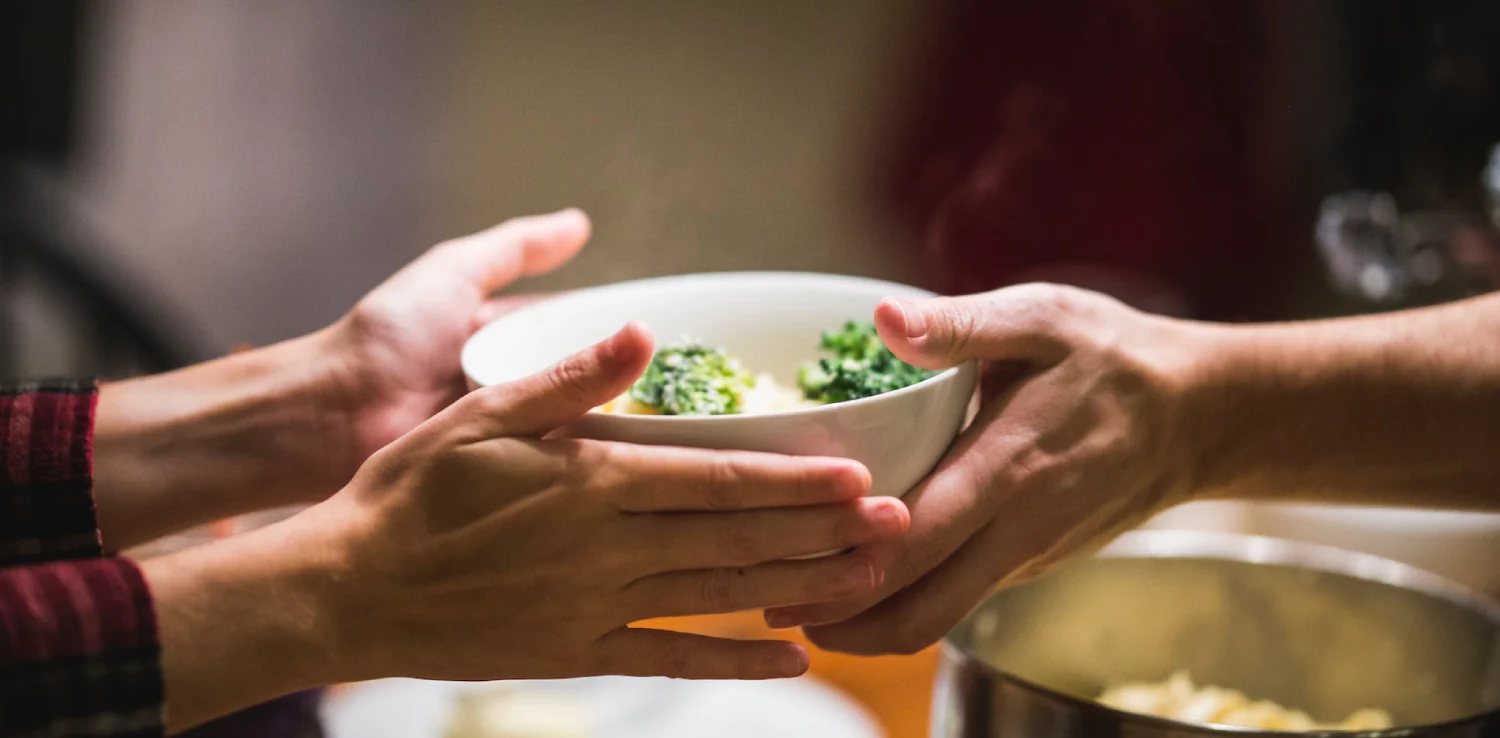 passing a bowl of food