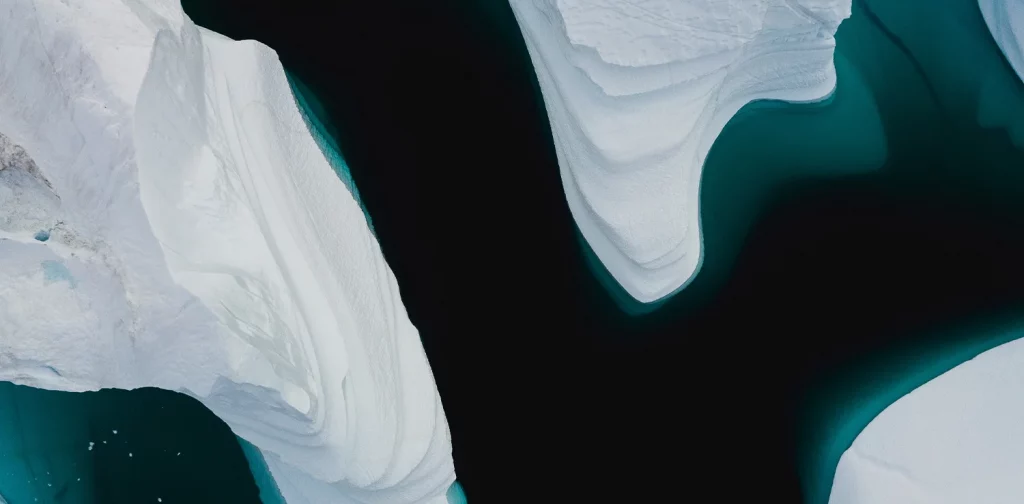 aerial view of melting arctic icebergs