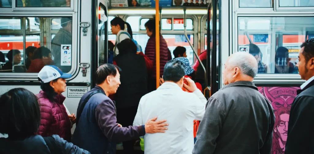 people gathered in front of a train entrance