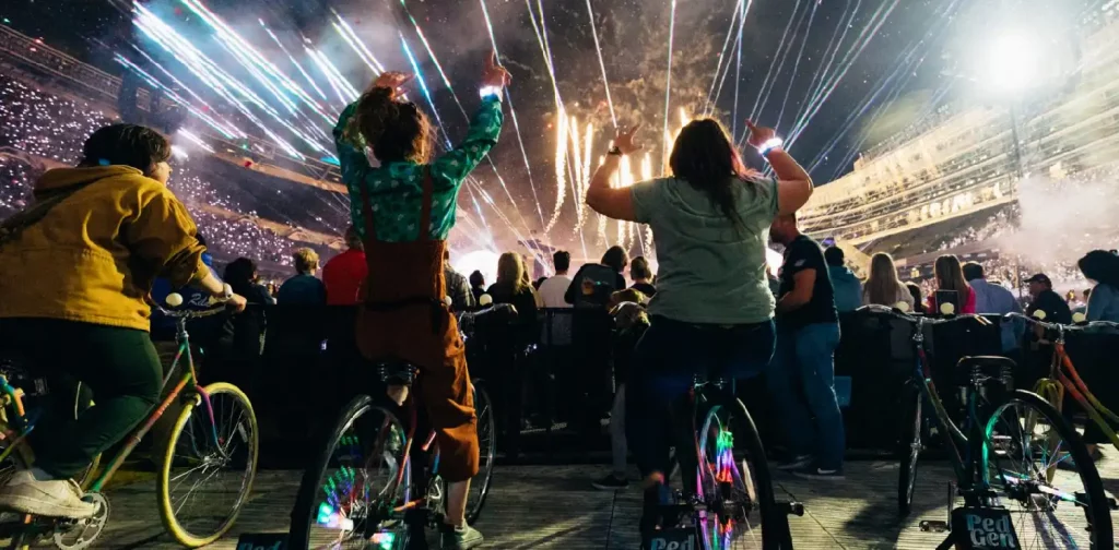 fans on power bikes during a coldplay concert