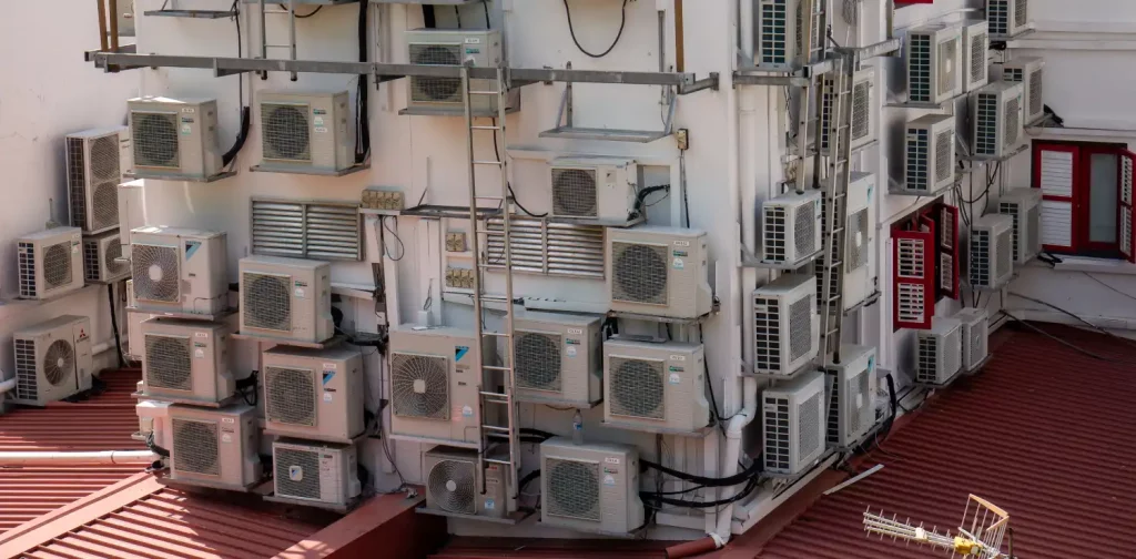 air conditioner condenser units attached to a residence building