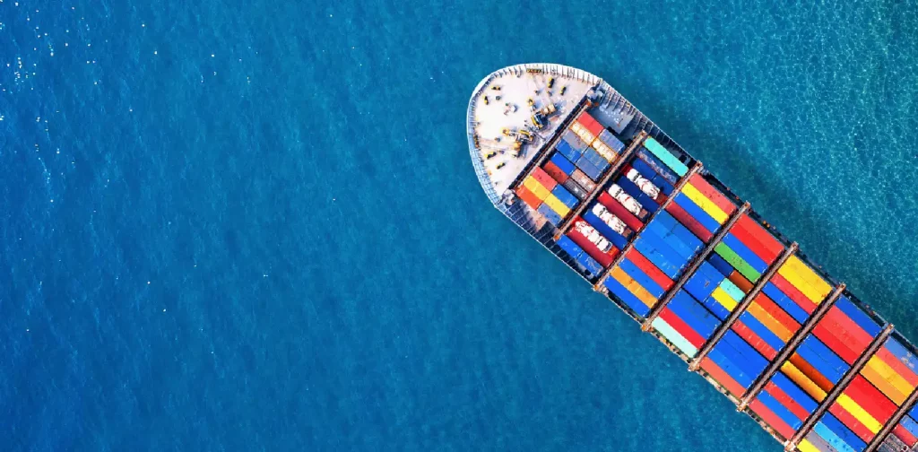 an aerial shot of container cargo ship at sea