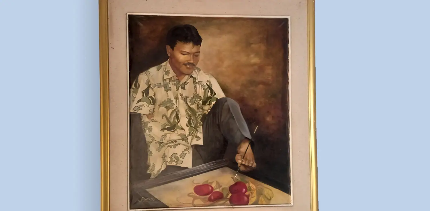 a painting of a man with disability painting using his foot