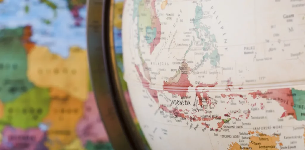 an old globe showing the map of Southeast Asia