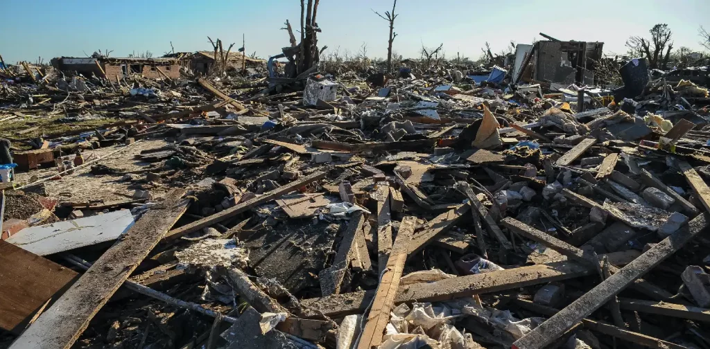 a pile of rubble with a blue sky in the background