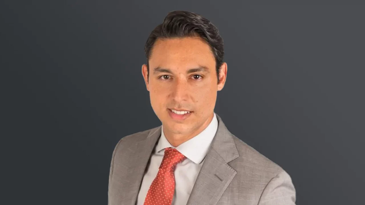a photo of Agustin Lopez Diaz, a short-haired man in gray suit