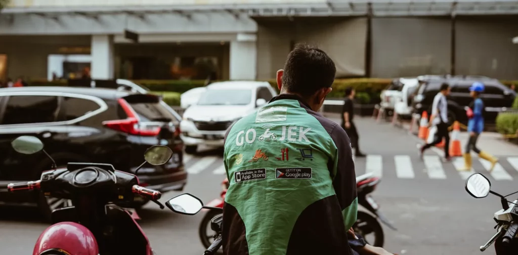 back view of an online motorbike taxi driver from gojek