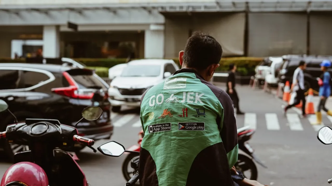 back view of an online motorbike taxi driver from gojek