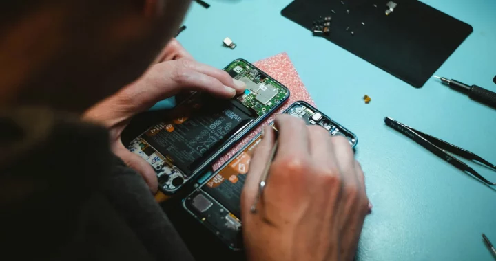 a person repairing a smartphone