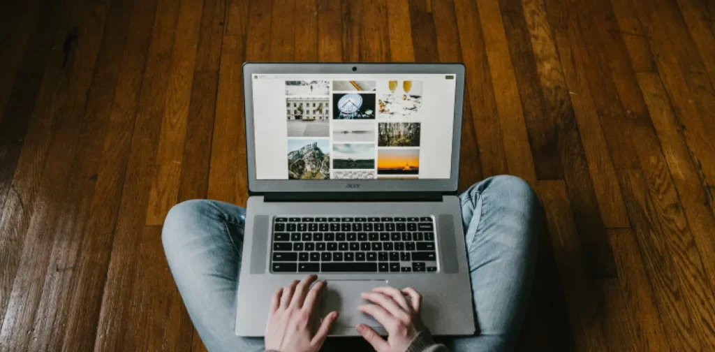 a person browsing the internet through a laptop