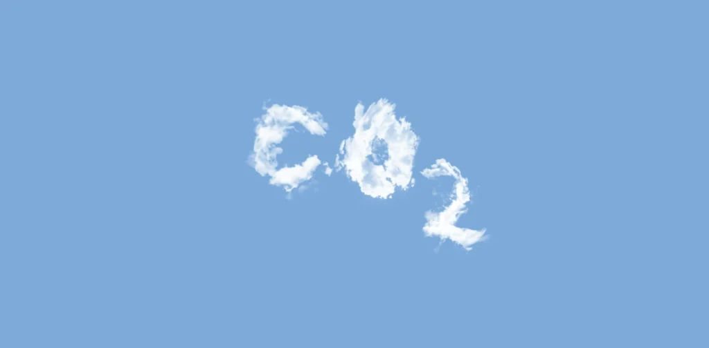 clouds forming the letter ‘CO2’ against a blue sky