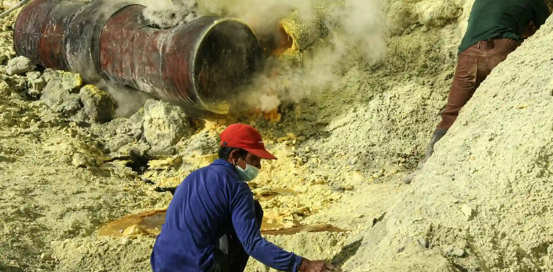 informal male worker working in sulphur mine