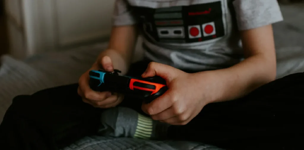 a kid playing Nintendo switch