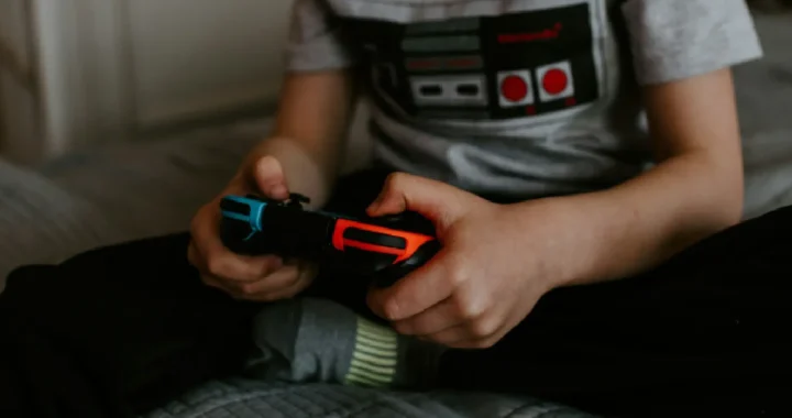 a kid playing Nintendo switch