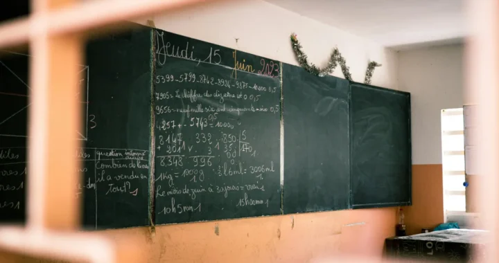 a black board in a classroom full of writing