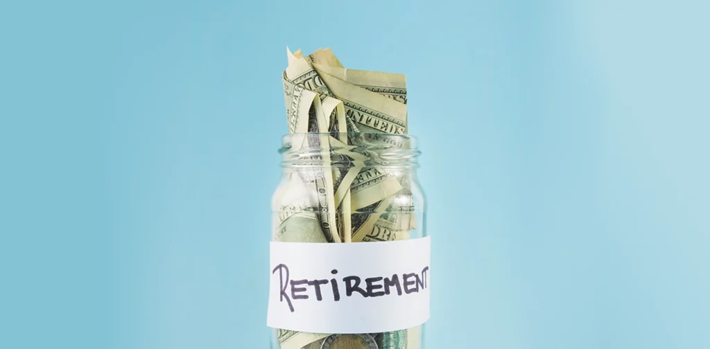 a jar full of money with retirement written on it