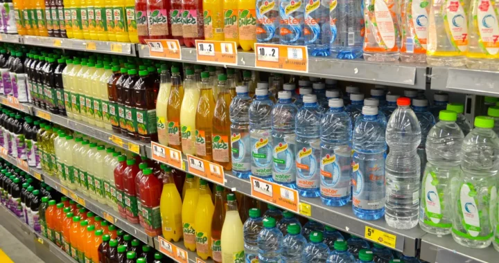 racks of plastic packaged beverages in a supermarket