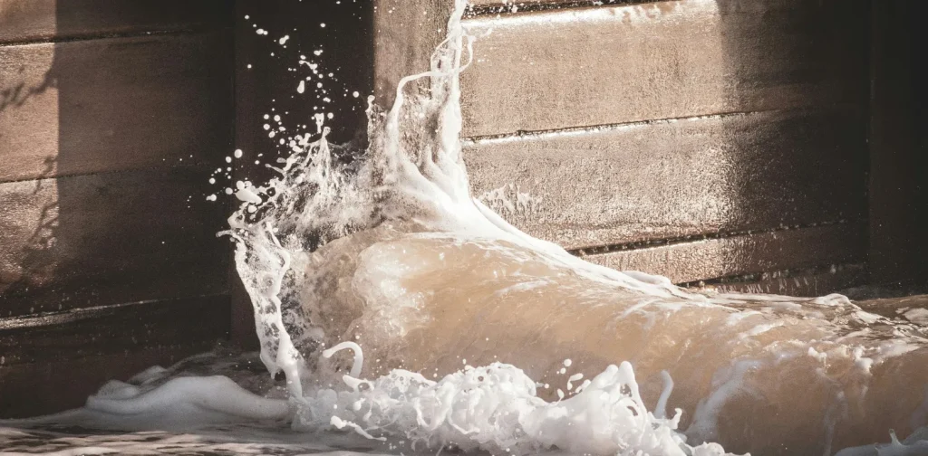 water crashing a solid wall