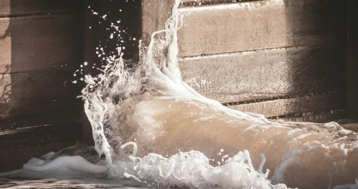 water crashing a solid wall