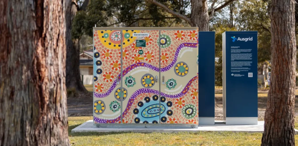 a community battery installation surrounded by trees