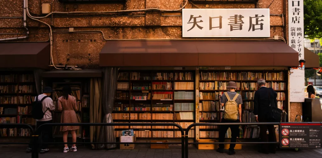 people standing in front of a Japanese bookstore