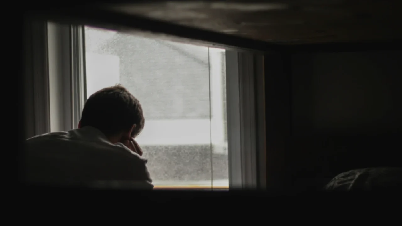 A man looking out the window