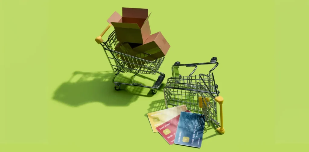 A toppled miniature of a card with empty boxes and credit cards spilling out