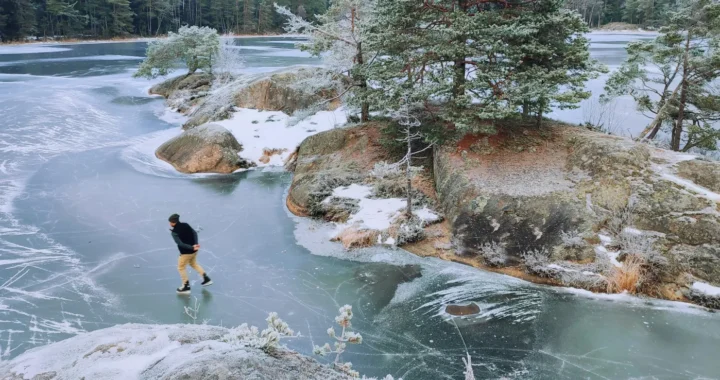 man skiing on frozen lake