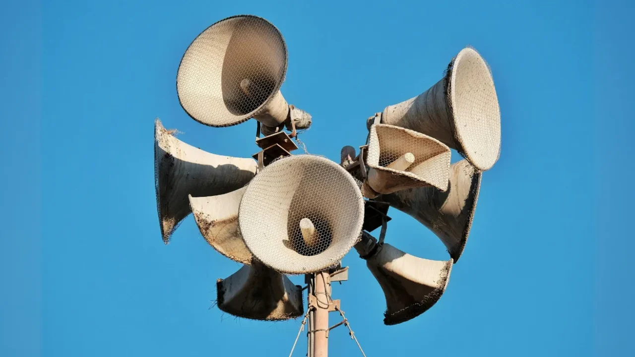 multiple megaphones attached on a pillar