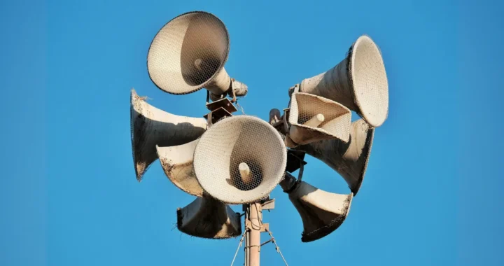 multiple megaphones attached on a pillar