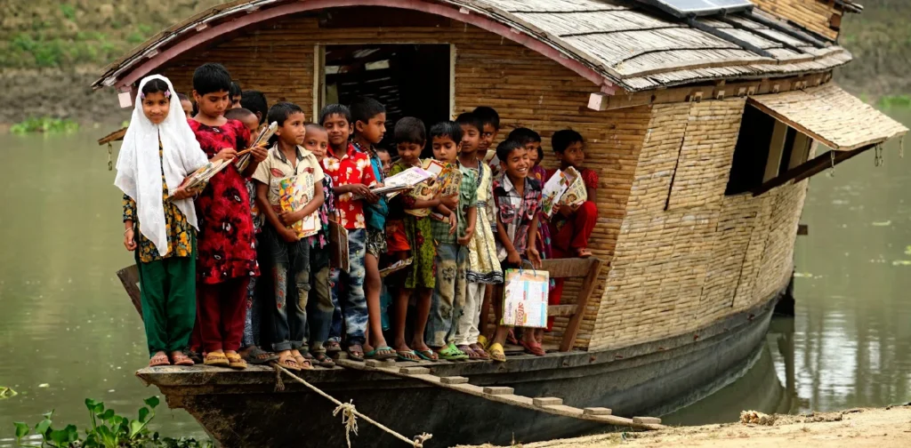 a group of children with studying items on a boat