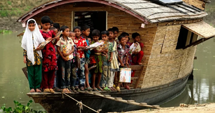 a group of children with studying items on a boat