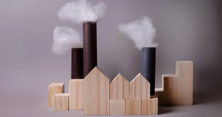 figure of houses and pipes that emit smoke