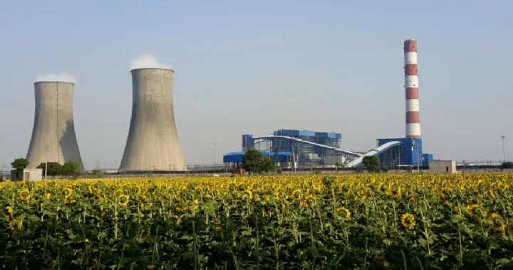 thermal power plant in india with smoke coming out of the stacks