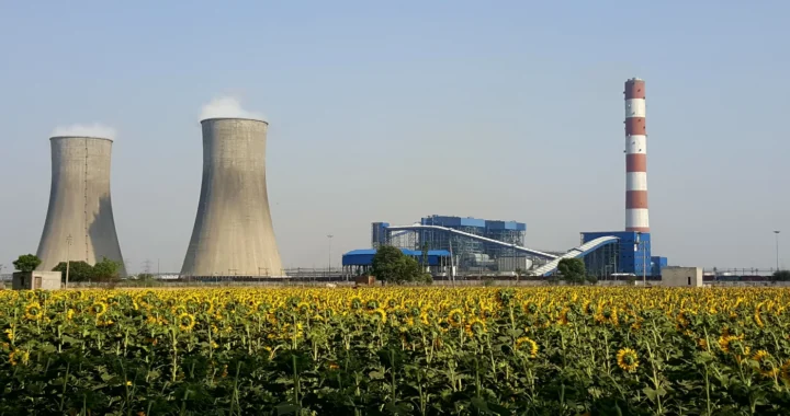 thermal power plant in india with smoke coming out of the stacks
