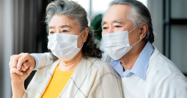 Elderly couple wearing mask
